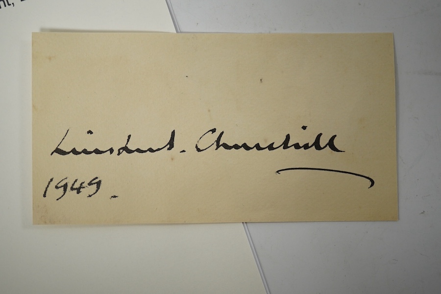 A Winston Churchill autograph on a section of note paper, dated 1949. Condition - good.